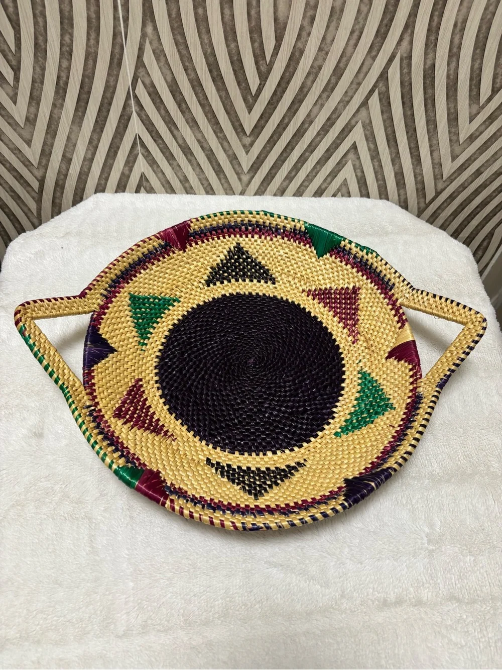African hand woven colorful wall basket with handles